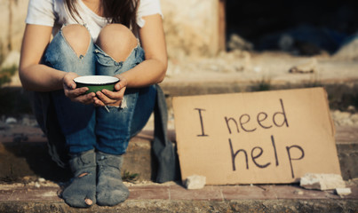 Poor woman begging for help on the street