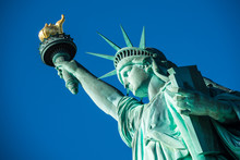 Portrait Statue Of Liberty At Perfect Weather Conditions Blue Sky Copper Torch
