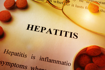 Wall Mural - Page of book with title Hepatitis and tablets.