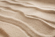 © Prostock-studio - Beach sand background. Natural seashore texture surface