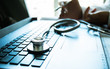 © smolaw11 - Medicine doctor's working on laptop computer and hand doctor on background. Focus on stethoscope