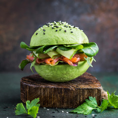 avocado burger with salted salmon and fresh vegetables