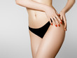 © looking2thesky - Women health and intimate hygiene. Beautiful Woman's body with smooth soft skin in black bikini panties. Epilation Concepts