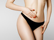 © looking2thesky - Women health and intimate hygiene. Beautiful Woman's body with smooth soft skin in black bikini panties. Epilation Concepts