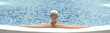 © looking2thesky - Woman relaxing on the swimming pool on sunny day. Girl relaxing at luxury travel resort
