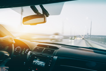 Wall Mural - Drive car at high speed at sunset