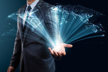 businessman holding abstract glow line and world map concept of global connection