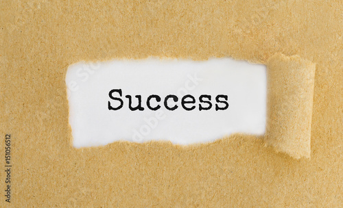 Cuadros en Lienzo Text Success appearing behind ripped brown paper