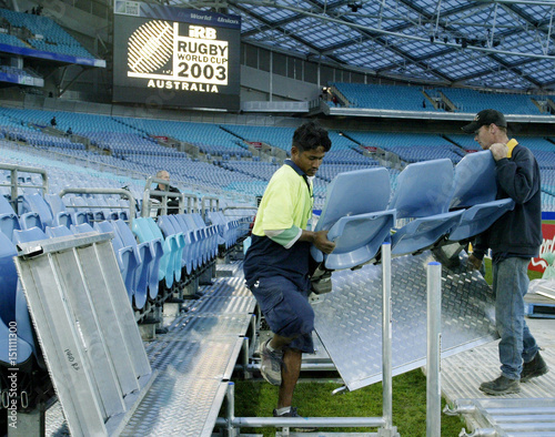 Stadium Workers Place Chairs Into Position Before Opening