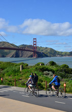 Tourists Riding Bikes Near The Golden Gate