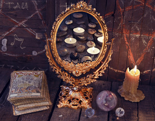 Wall Mural - magic mirror with tarot cards and mystic objects. divination rite