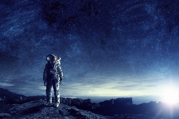 Wall Mural - astronaut in outer space. mixed media
