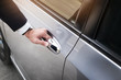 © snowing12 - Chauffeur s hand on handle. Close-up of man in formal wear opening a passenger car door