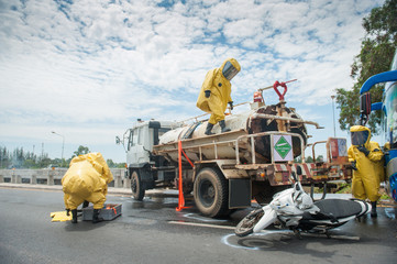 Poster - firefighter with hazmat (hazardous material) suits to protect them from danger chemical work on the accident road