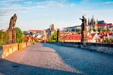 Sunny Spring Scene On Charles Bridge On Vltava River (Karluv Most) With Statues And Prague Castle