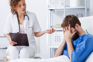 Psychotherapy nurse helping crying patient