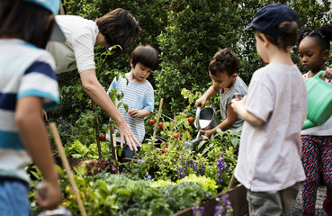 Teacher and kids school learning ecology gardening