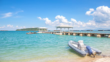 Speed Boat Anchor On White Sand Beach With White Wooden Bridge,Assadang , In Sea