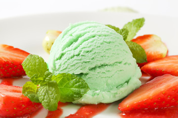 Wall Mural - Green ice cream with strawberries