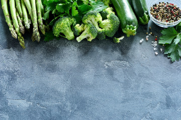 Wall Mural - Green vegetables for healthy cooking, copy space food background , harvest or diet concept, asparagus, zucchini, broccoli, vegan eating