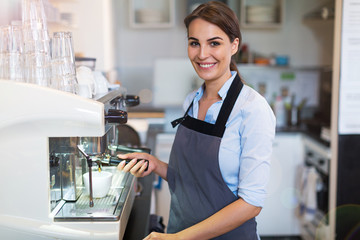 Wall Mural - Woman working in coffee shop
