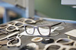 © Maskot - Eyeglasses frames on table at workshop