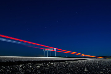 Photo of country road with traces of light vehicles