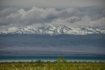 Wall Mural - Mountain tops and Issykkul lake in Kyrgyzstan