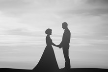 Silhouette Married Lovers Couple Over Natural Background At The Beach 