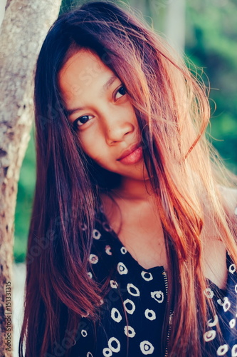 Natural Portrait Of Beautiful Young Asian Girl Smiling With Messy