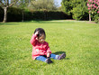 © M-image - baby girl playing meadow on sunny day