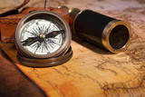 Fototapeta Mapy - Old Compass and Telescope on a Vintage Map