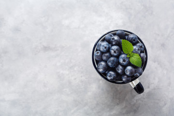 Wall Mural - Fresh blueberries in a cup