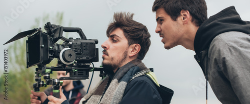 Behind the scene. Cameraman and film director shooting film scene Tableau sur Toile