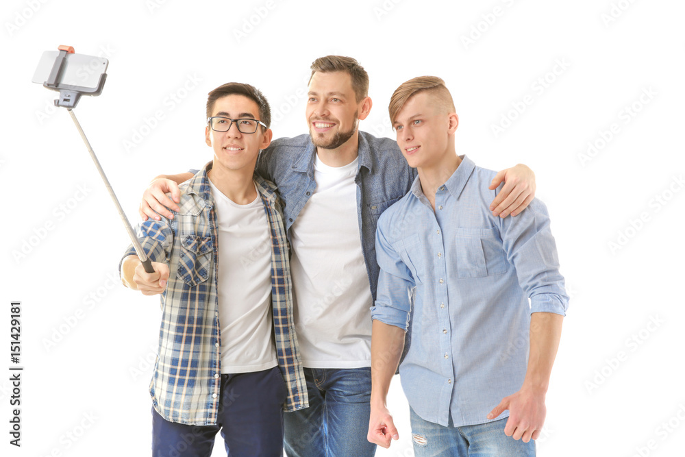 Handsome young men taking selfie on white background