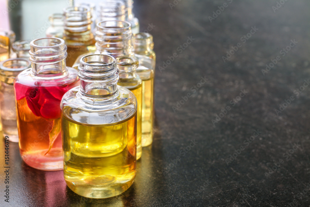 Different perfume bottles on table