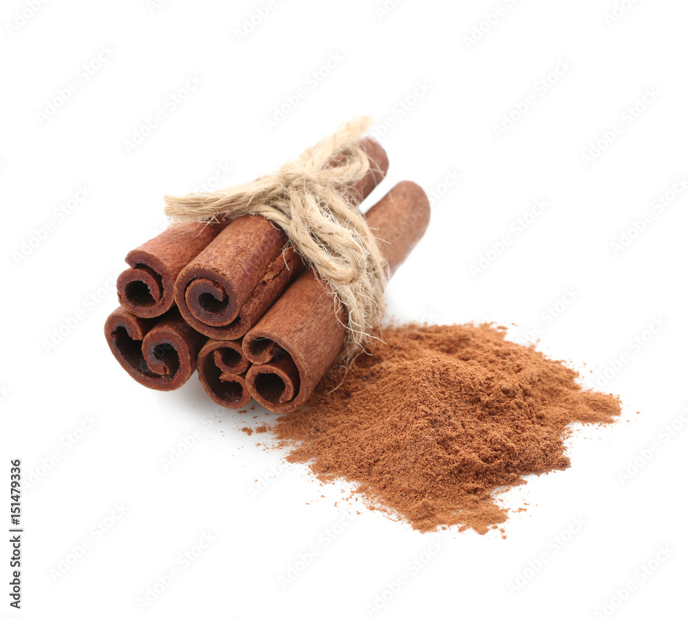 Tied cinnamon sticks and powder isolated on white