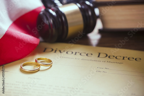 Close Up Of Wedding Rings On Wooden Table With American Flag Buy