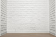 © soleg - white brick wall with tiled floor, abstract background photo