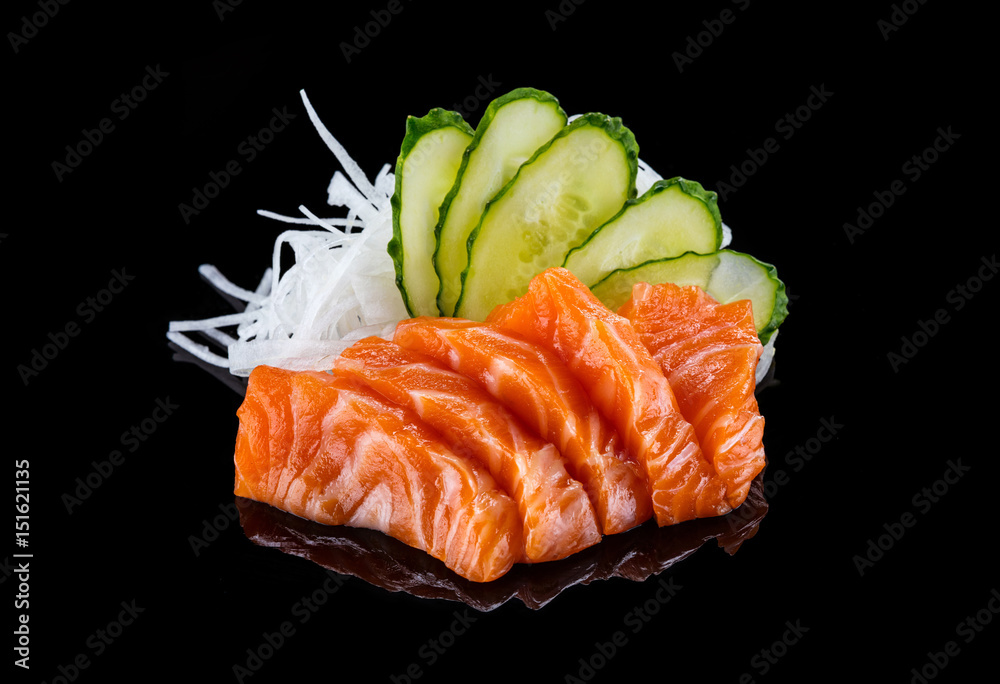 Salmon sashimi over black background - obrazy, fototapety, plakaty 