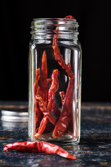 Wall Mural - Dried Red Chili Peppers in a Spice Jar