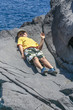 © travelview - happy boy lies on the rock