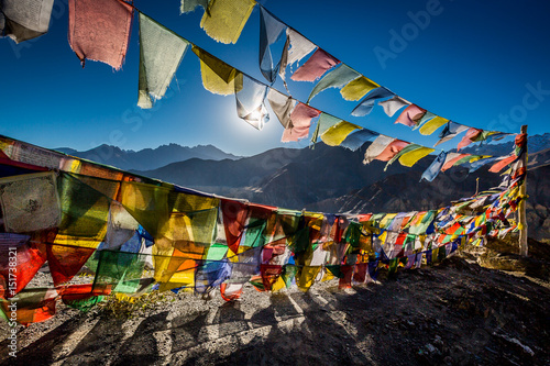 Fotomural Colourful Buddhist prayer flags near Lamayuru monastery in the Himalayan mountai