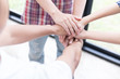 © 88studio - young college student joining hand, business team touching hands together - unity, harmony, teamwork, friends concept