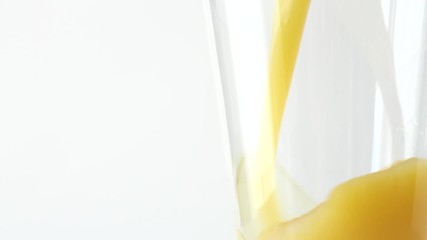 Wall Mural - Freshly squeezed orange juice in a glass. White background. Healthy eating.