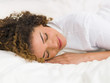 Pretty woman portrait smiling while sleeping soundly