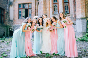 Beautiful bride with her pretty bridesmaids