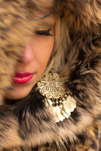 Sexual Beautiful Girl Wrapped In A Warm Fur. Small Depth Of Sharpness 