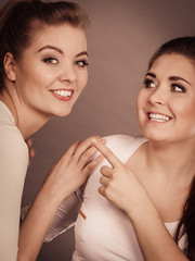 two happy women friends having fun