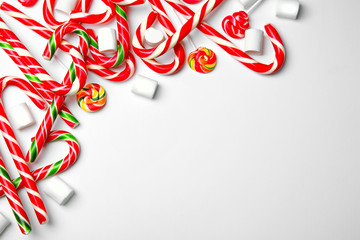 Wall Mural - Composition with Christmas candy canes on white background